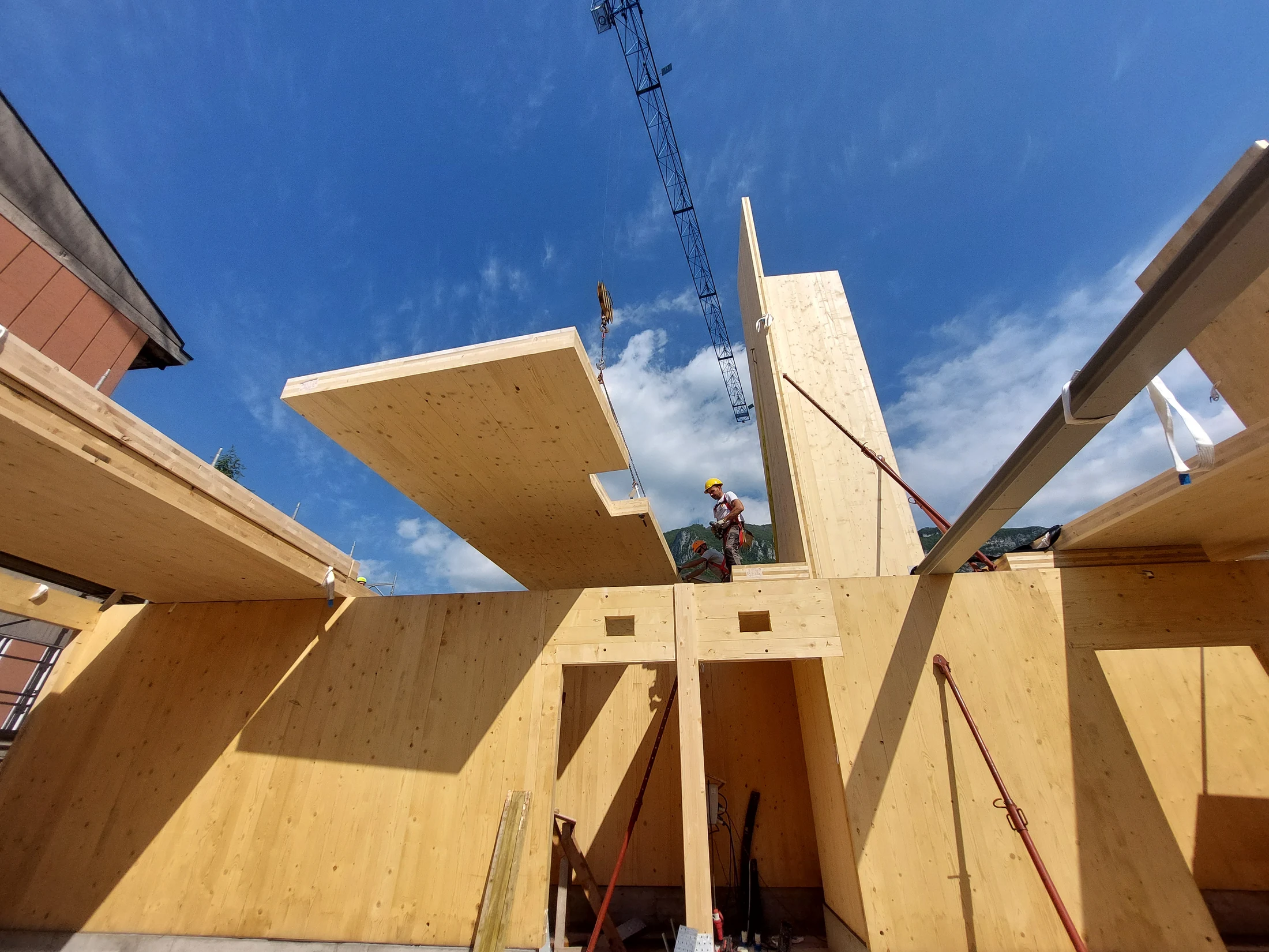 Cross-laminated timber components being installed on a construction site
